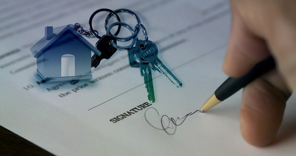 A homebuyer (or homebuyers) - signing the contract