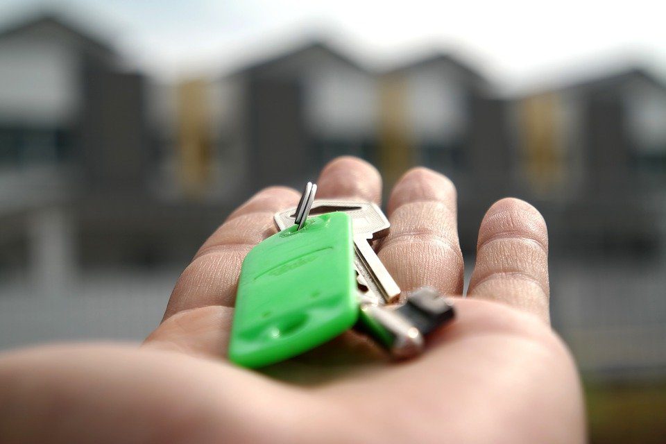 A homebuyer holding the keys